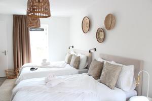 Uma cama ou camas num quarto em Hotel Paradis Zandvoort