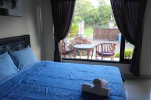 Postel nebo postele na pokoji v ubytování Ady Homestay