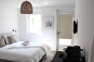 Uma cama ou camas num quarto em Hotel Paradis Zandvoort