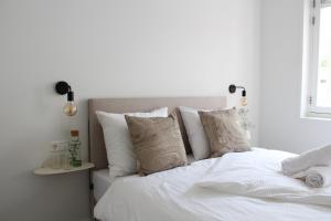Uma cama ou camas num quarto em Hotel Paradis Zandvoort