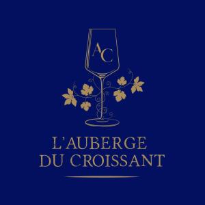 a wine glass with a crescent and autumn leaves at L'Auberge du Croissant in Rochecorbon