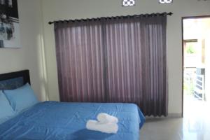 Postel nebo postele na pokoji v ubytování Ady Homestay