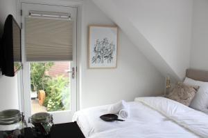 Uma cama ou camas num quarto em Hotel Paradis Zandvoort