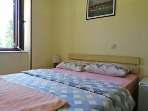 Postel nebo postele na pokoji v ubytování Hotel Pelikan