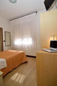 Postel nebo postele na pokoji v ubytování Hotel San Giuliano