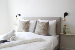 Uma cama ou camas num quarto em Hotel Paradis Zandvoort