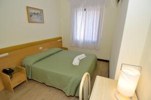Postel nebo postele na pokoji v ubytování Hotel San Giuliano