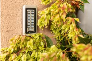a remote control attached to the side of a wall at Skadarlija Suites in Belgrade
