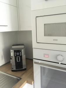 Kuchyňa alebo kuchynka v ubytovaní Rezidencia AMÉLIA - Apartmán SOFIA