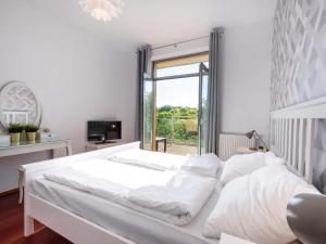 Posteľ alebo postele v izbe v ubytovaní VacationClub – Diune Apartament 60 + 10 fotografií