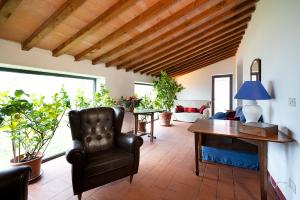 a living room with a leather chair and a table at Poggio a Sieve in Villore