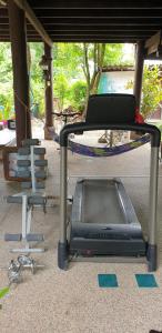 a tv sitting on the ground next to a swing at Marin' s Home in Thalang