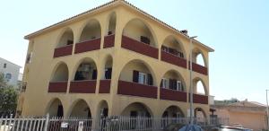 a building with arches on the side of it at Maison Kainà in Olbia