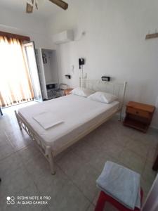 Postel nebo postele na pokoji v ubytování Hotel Galini