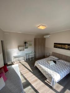 A bed or beds in a room at B&B Panorama Iseo