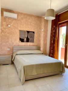 Posteľ alebo postele v izbe v ubytovaní Casa sul mare