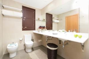 a bathroom with a toilet and a sink at Lux Apartments Barcelona in Barcelona +58 photos