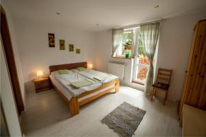 Postel nebo postele na pokoji v ubytování Pokoje Gościnne Boryna