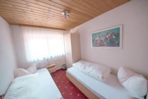 Postel nebo postele na pokoji v ubytování Haus Bergkastelblick