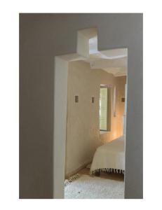 a bedroom with a bed in a room with a window at Dar Zahia in Taroudant