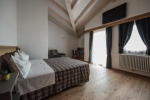 Posteľ alebo postele v izbe v ubytovaní Agritur Renetta