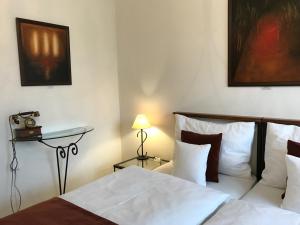 Voodi või voodid majutusasutuse Antik Hotel Sofia toas