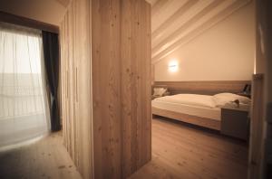 Posteľ alebo postele v izbe v ubytovaní Agritur Renetta