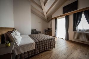 Posteľ alebo postele v izbe v ubytovaní Agritur Renetta