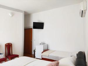 Posteľ alebo postele v izbe v ubytovaní Guesthouse Varnica