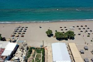 an aerial view of a beach with cars and trees at Blue Boutique Apts in Amoudara Herakliou