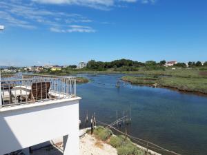 a view of a river from the balcony of a building at Torre del Lago in Foce Varano