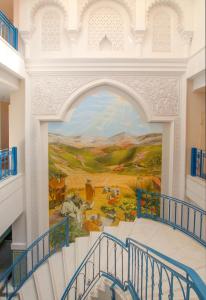 a mural on a wall in a building with a staircase at Apartamento Vista Lotos in Puerto de la Cruz +11 photos