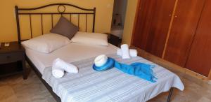Ένα ή περισσότερα κρεβάτια σε δωμάτιο στο Ilios Apartments