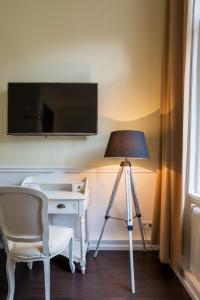 TV a/nebo společenská místnost v ubytování Boutique Hotel Columbia