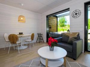 a living room with a couch and a table at Holiday Home Kasnäs marina b12 by Interhome in Kasnäs