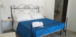 Łóżko lub łóżka w pokoju w obiekcie Le Sirene