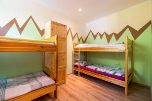 two bunk beds in a small room with at Bled Hostel in Bled