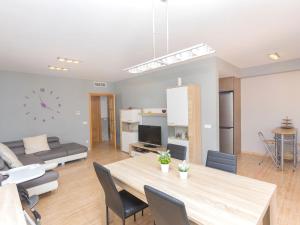a living room with a table and a couch at Holiday Home Nova by Interhome in Segur de Calafell +17 photos