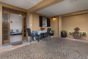 a living room with a table and chairs and a couch at Apartments Beni in Matulji +50 photos