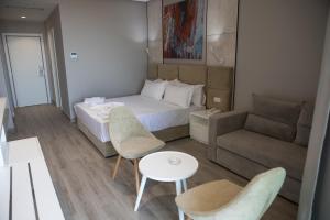 Letto o letti in una camera di Hotel Qeparo