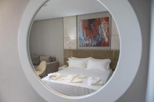 Letto o letti in una camera di Hotel Qeparo