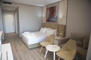 Letto o letti in una camera di Hotel Qeparo