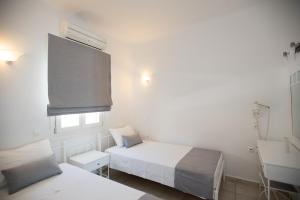 Postel nebo postele na pokoji v ubytování Villa Nireas