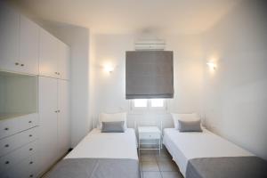Postel nebo postele na pokoji v ubytování Villa Nireas