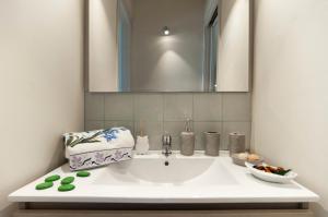 Koupelna v ubytování Rhomy Apartment + 14 fotografií