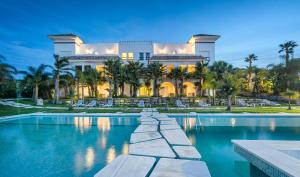 a large house with a pool in front of it at Mnar Castle in Tangier