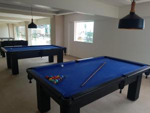 two pool tables in a living room with sidx sidx sidx at Salinas Park Rersort in Salinópolis