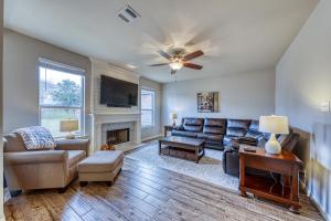 a living room with a couch and a fireplace at Living the Dream in San Antonio