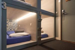 a room with two bunk beds inside of a door at Vert Lodge Chamonix in Chamonix-Mont-Blanc