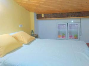 Ein Bett oder Betten in einem Zimmer der Unterkunft Casa Valentina y La buhardilla